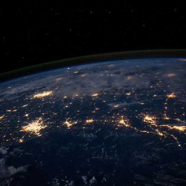 Earth at night, glowing city networks from space